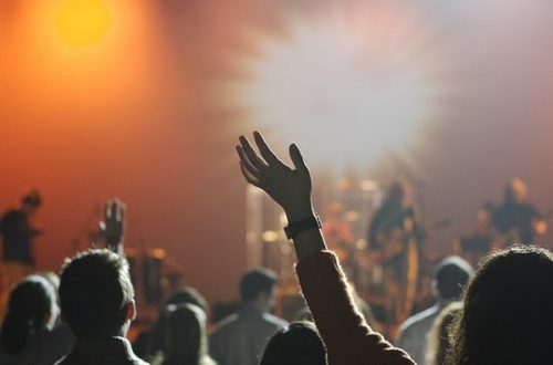 Hands in the air at a concert.